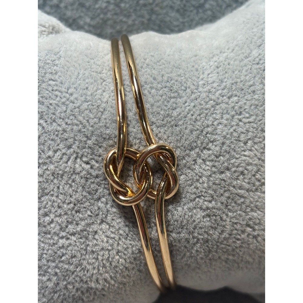 #17. Gold-tone Love Knot Cuff Bracelet